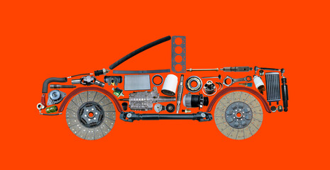 Car assembled from new spare parts isolated on red background. New spare parts for shop.