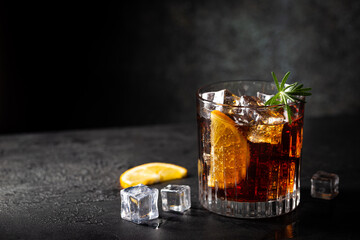 Fresh made Cuba Libre cocktail with brown rum, cola and lemon on wooden background - obrazy, fototapety, plakaty