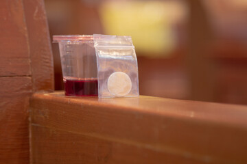 Communion New Normal Style - In One Time Use Containers To Protect People From The Pandemic COVID-19