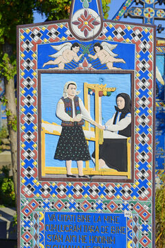 Carved and painted wooden crosses in the Merry Cemetery is visited by crowds of tourists every year, Sapanta, Romania