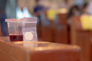Communion New Normal Style - In One Time Use Containers To Protect People From The Pandemic COVID-19
