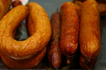 Sausage on the counter. Cooked-smoked sausage delicacies