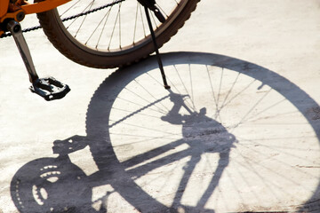 Bicycle wheel shadow on concrete road 1