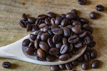 caffee beans in the wooden spoon