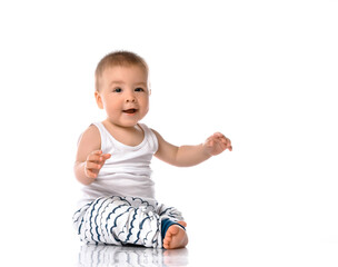 Happy baby boy sitting and laughing