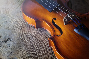 Violin on a wooden background. Stringed musical instrument. Classical music. © SeventhSun