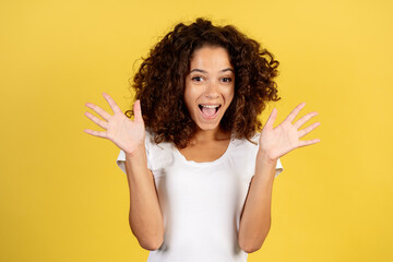 Young african american woman on yellow copy space background