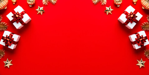 Merry Christmas and Happy Holidays greeting card, frame, banner. New Year. Noel. Christmas ornaments and gift on red background top view. Winter xmas holiday theme. Flat lay	
