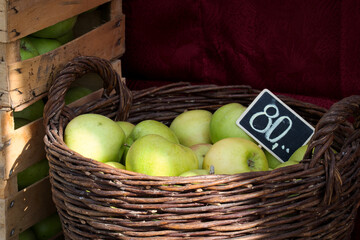 Autumn harvest -  a basket full of green apples on the farmers' market - zelena pijaca in Novi Sad, Serbia