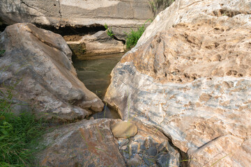 Fototapeta na wymiar big rock in a river in southern Spain