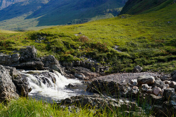 Naklejka na ściany i meble A waterfall in Glen Etive in the Scottish highlands