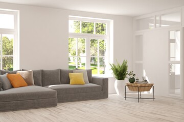 White living room with sofa and summer landscape in window. Scandinavian interior design. 3D illustration