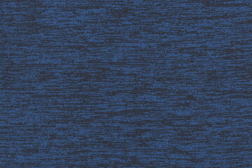 The texture of the knitted fabric is blue with black speckles. Soft fabric, casual clothing. Abstract monochrome background.
