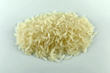 Hill of rice on a white background, close-up. Focus Stacking.