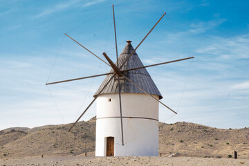 Fototapeta na wymiar white windmill in the spain desert