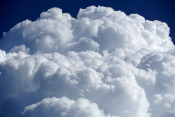 Big white fluffy cloud on the blue sky