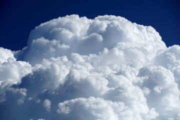 Naklejka na ściany i meble White big cloud on the blue sky