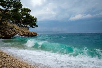 waves approaching the beach, empty beach after storm, croatia, blue water