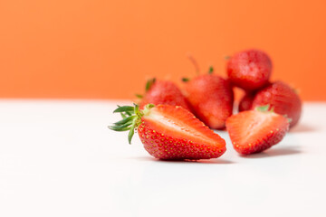 Fresh strawberry in ceramic jar on white