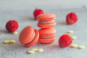Macaroons. Delicious french desserts. Macaroons on the table. Macaroons with strawberries
