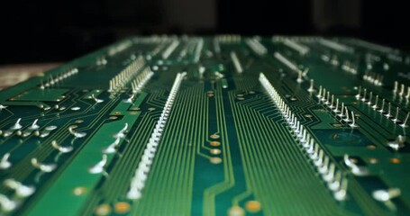 Circuit board macro with probe lens pushing in - Powered by Adobe