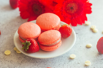 Macaroons. Delicious french desserts. Macaroons on the table. Macaroons with strawberries