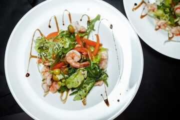 Green salad with shrimps. Healthy seafood meal