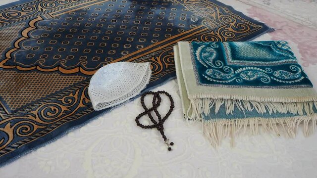 prayer rug rosary and skullcap to worship, to worship in Islam,