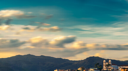Panoramic view from Congonhas, MG, Brasil. Church and moutains with a lot of clouds as background