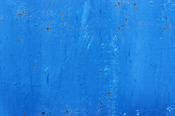Old cracked blue wall background. Rusty metal with blue paint