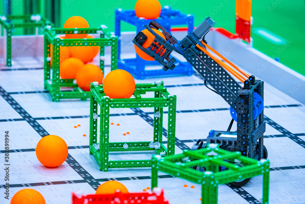 Poster robotics. programmable robot on a special platform. robot playing basketball. basketball player. the