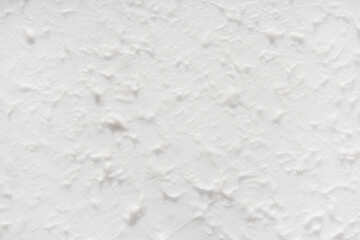 Textured white background. Beautiful white background with a three-dimensional texture. Selective focus.
