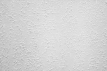 Textured white background. Beautiful white background with a three-dimensional texture. Selective focus.
