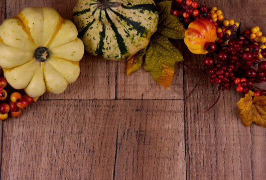 Autumn decoration on a wooden background frame stock images. autumn decoration with pumpkins top view. Autumn season border stock images. Natural fall harvest background stock photo