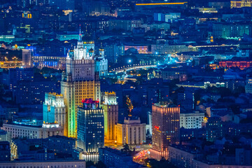 Evening Moscow. Russia. Lights of the Russian capital. The building of the Ministry of foreign Affairs in Moscow with evening lighting. Panorama of Moscow in the evening. Capital from a height.