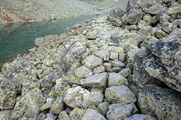 Pond in Valley of Five Spis Lakes surrounded by rocky summits, High Tatra Mountains. Slovakia