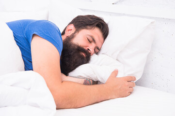 Top view of handsome mature man in shirt sleeping in bed, healthy sleep