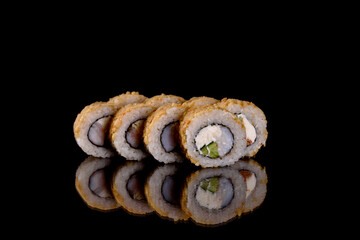 Fresh delicious beautiful sushi rolls on a dark background