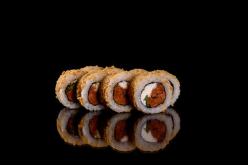 Fresh delicious beautiful sushi rolls on a dark background