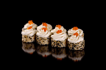 Fresh delicious beautiful sushi rolls on a dark background