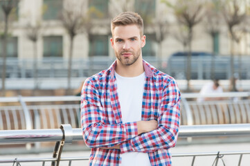 Confident in his choice. casual dressed person relax in city outdoor. Caucasian male resting in...