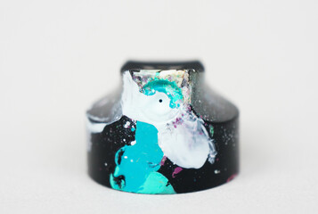 modern art concept, aerosol paint cap, graffiti theme, paint splatter smudges