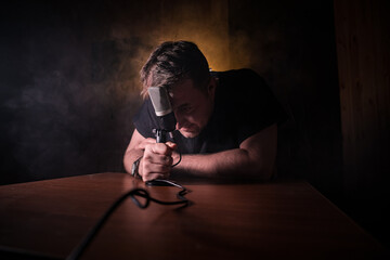 Serious reporter in television studio looking at the camera