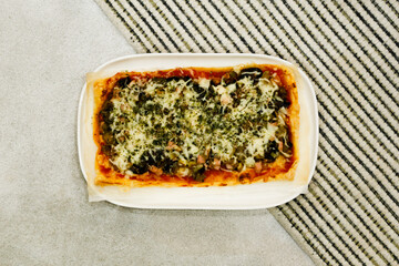 Top view of rectangular pizza on lines background