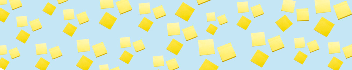 a large number of stickers for notes on a blue background. pattern. isolate