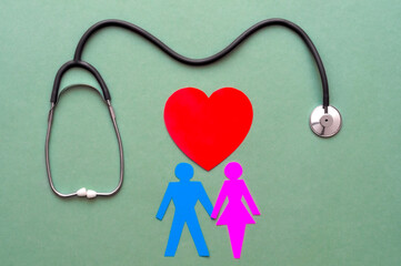 Family paper cut out with red heart and stethoscope, heart health, family health insurance concept.