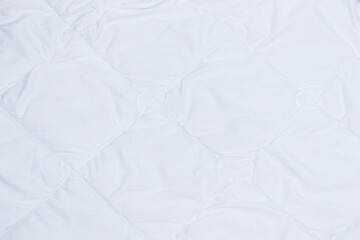 White soft bedding blanket. Texture and background.