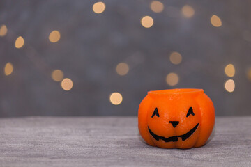 Halloween background with pumpkin, part lights, copy space.