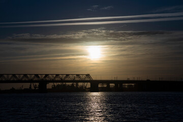 Bridge over the river at sunrise. Morning landscape.