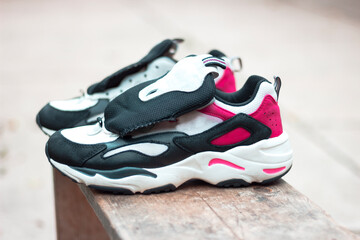 black and pink taper on the street sneaker